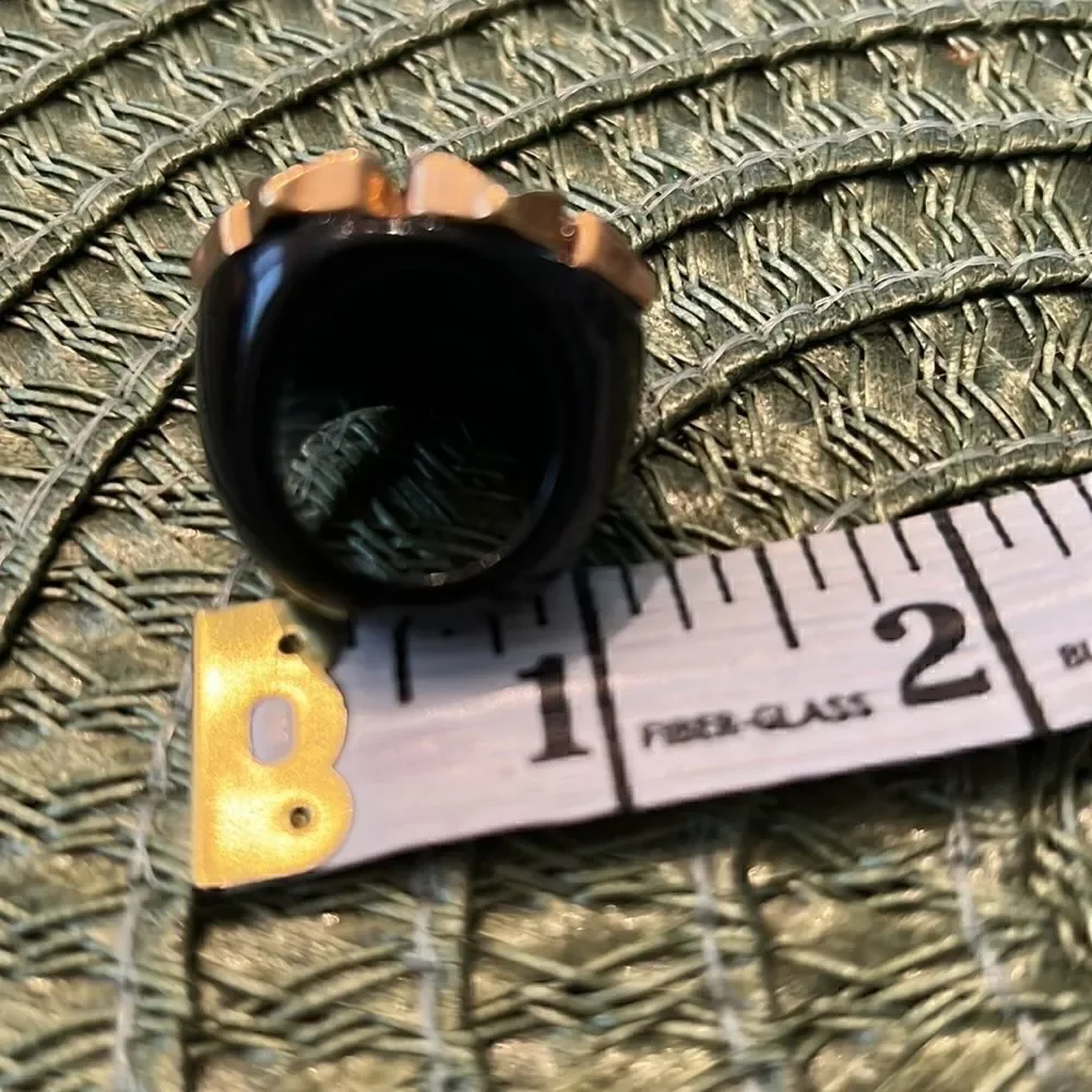 Simply stunning navy blue with gold colored trim and crystals flower ring EUC